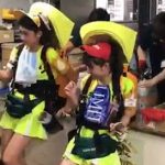 Japanese female beer sellers at a baseball stadium in Tokyo show how to re-fuel with speed