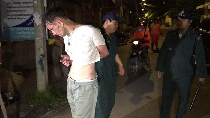 British tourist Jon Williams, 43, is arrested after a naked rampage while allegedly attacking people in Cambodia