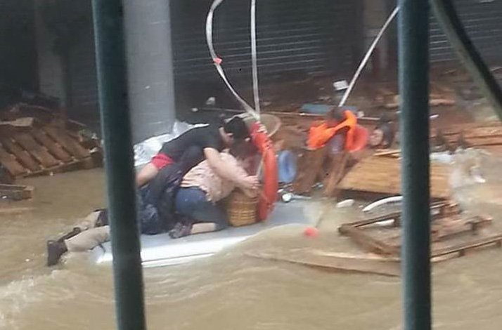Loreto De Guia Mijares Jr., 30, rescues the elderly couple from a flash flood caused by Typhoon Hato in Macau
