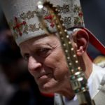 Archbishop of Washington prostrates himself at mass for abuse victims