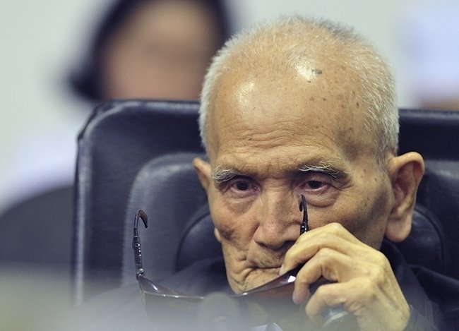 Nuon Chea, who was the Khmer Rouge’s chief ideologist and No. 2 leader, sits in a court room before a hearing at the U.N.-backed war crimes tribunal in Phnom Penh, Cambodia, Friday, Nov. 16, 2018. (Mark Peters/Extraordinary Chambers in the Courts of Cambodia via AP)