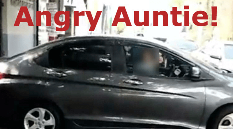Angry auntie parked her car in the middle of the road to take a nap.