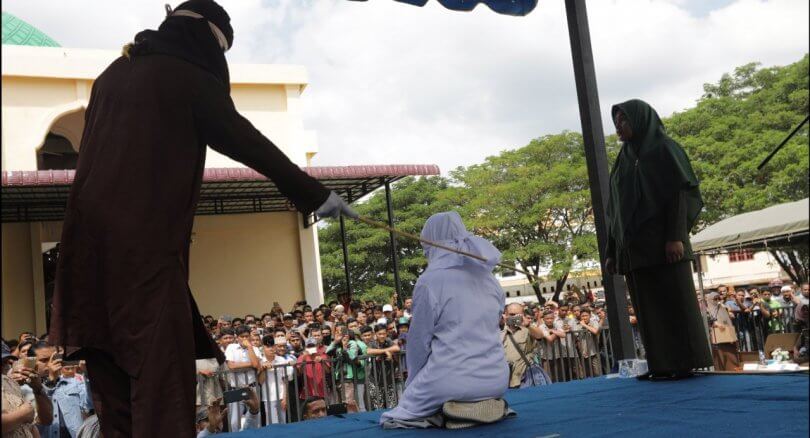 Indonesia's Aceh whips teens for public cuddling