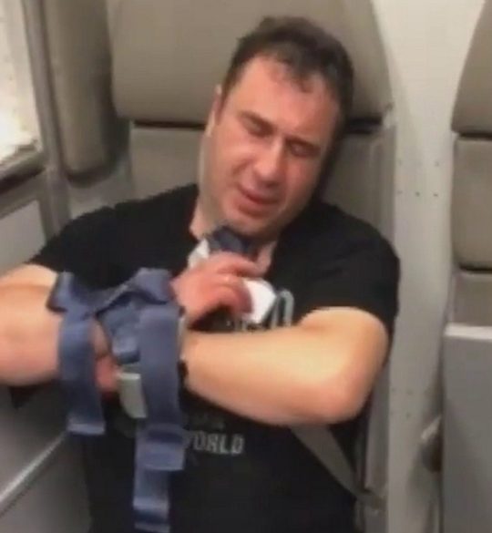 Aggressive doctor restrained on flight from Bangkok