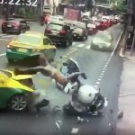Military escort motorcycle smashes into Bangkok taxi