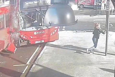 Shocking moment London bus driver crashes into depot