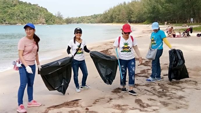 Tourists join the clean up of Phuket beaches
