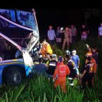 Passenger bus rear-ends lorry. 1 DEAD 33 injured