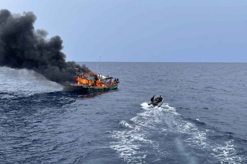 Fishing boat burns, sinks after being caught