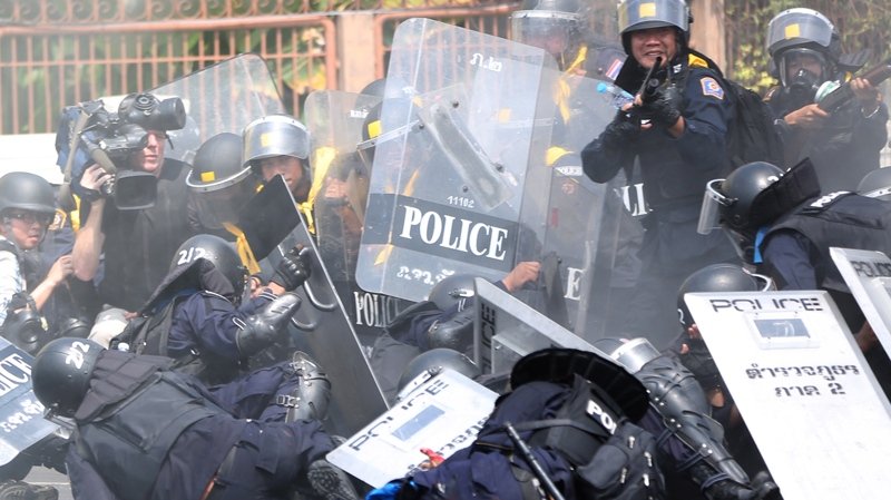 Photo journalists injured want riot cops probed