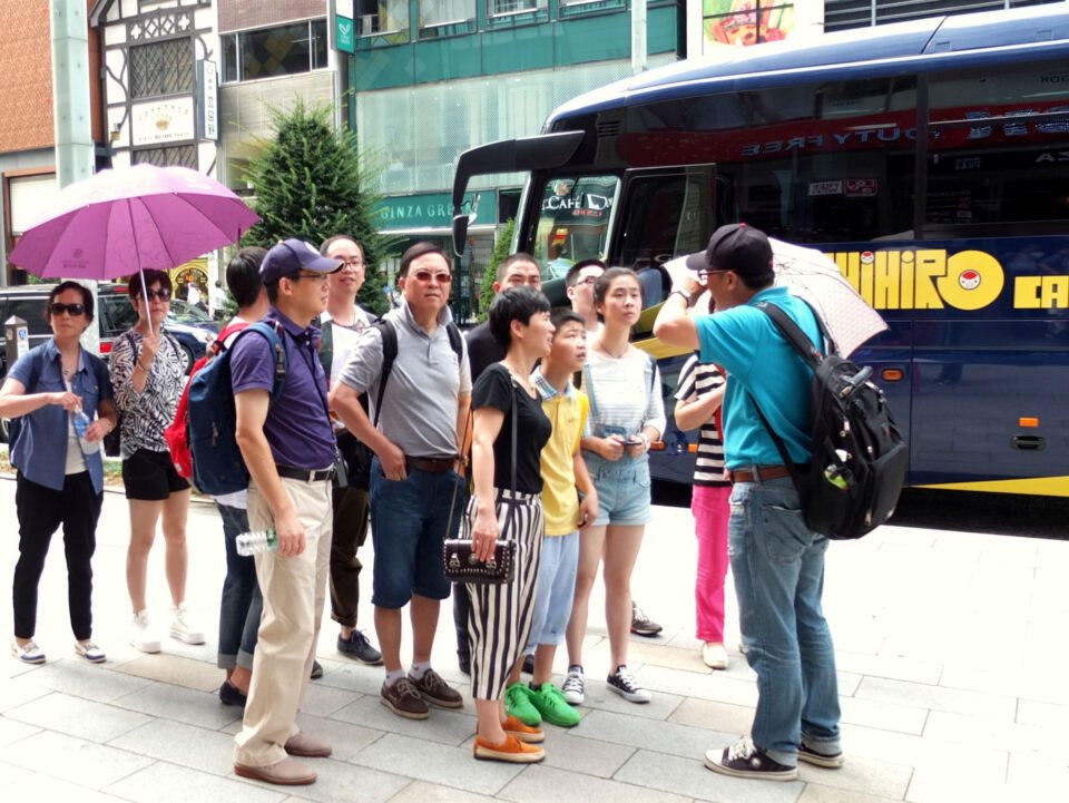 chinese tourists on busses