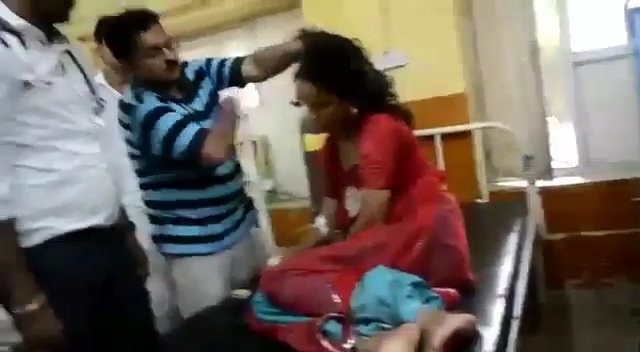 A doctor provides his own unique brand of treatment by slapping a 'possessed' patient in India