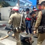 Bangkok police address student brawl