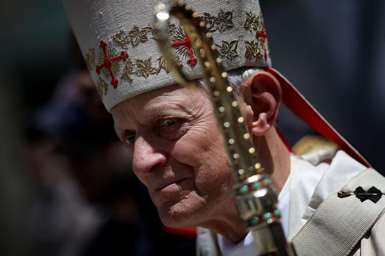 Archbishop of Washington prostrates himself at mass for abuse victims