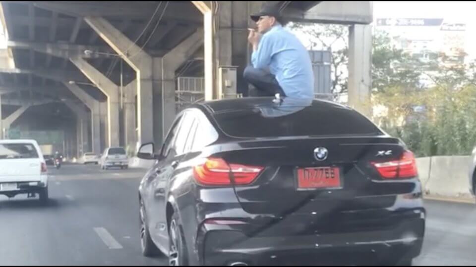 Driver Sits On Car Roof After Crash