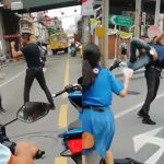 Live boxing on road between taxi and motorbike driver