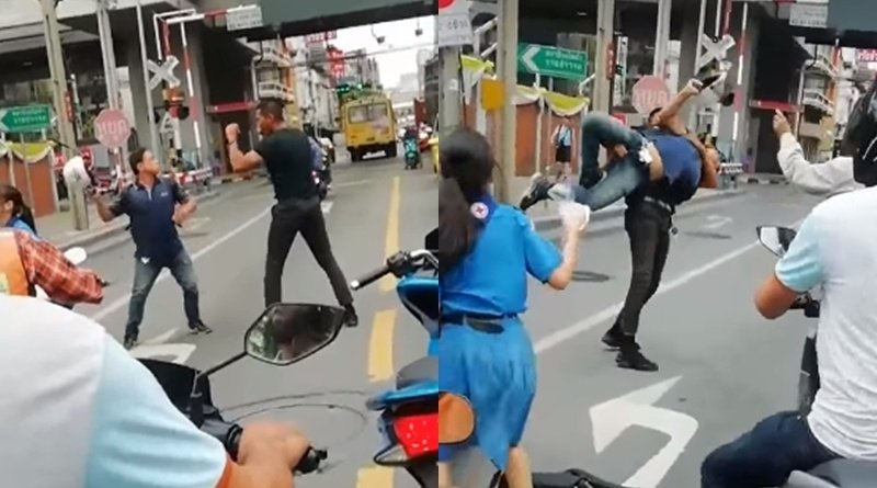 Live boxing on road between taxi and motorbike driver