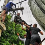 Police paratrooper lands on high voltage cables