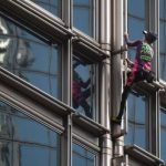 French ‘Spiderman’ scales Hong Kong skyscraper forPEACE