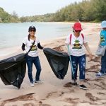 Tourists join the clean up of Phuket beaches