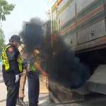 vehicles emitting black smoke