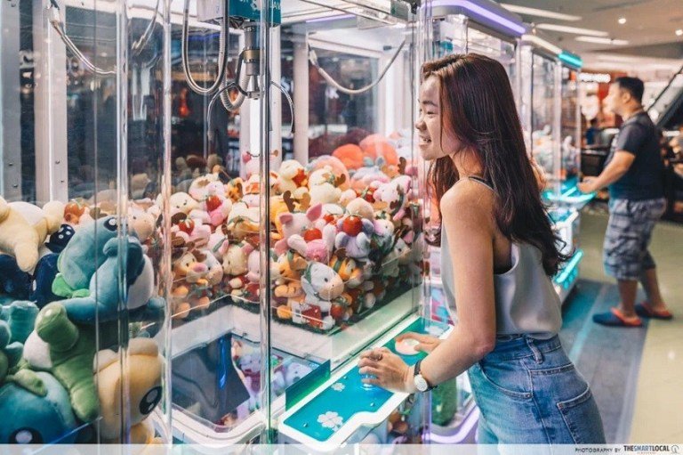 Ministry officials will inspect shopping malls. Operators of unlicensed machines will be given a warning or face arrest if they repeatedly ignore the warning.  Last month, youth activists urged the government to enforce a ban on arcade claw crane machines.  Nutthapong Sampaokaew, a coordinator of the No Gambling Youth Club, said the machines are found in many shopping malls throughout the country. Also that young people have unrestricted access to them.  The coin-operated crane claw machines are very popular with thai Thai youth. They entice young children on working a crane claw to pickup toys inside a glass display case. As the youth have to pay and the prize isn’t guaranteed, its gambling, Mr Nutthapong said.  He also said the Gambling Act categories the machines as serving a betting purpose. A definition confirmed in a Supreme Court ruling. However, the machines operate freely at department stores and attract many youngsters.  Mr Nutthapong cited a survey it conducted in 92 shopping malls in 10 provinces including Bangkok. It found more than 1,300 machines are in place at 75 malls.