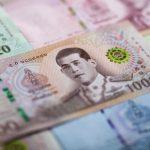 Baht strengthens