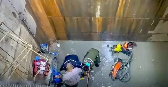 Close Call Biker crashes into six meter road hole in Bangkok