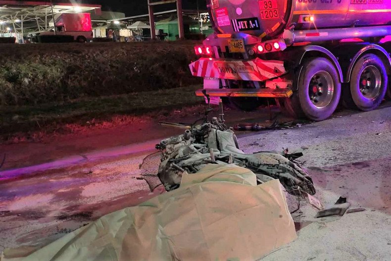 Biker dies in crash with parked truck