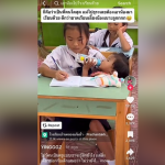 5th grader feeding toddler while studying in class