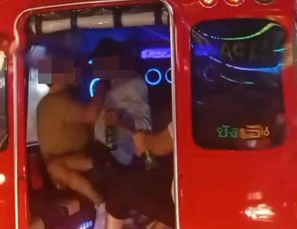 Foreign tourists have fun on a tuk-tuk